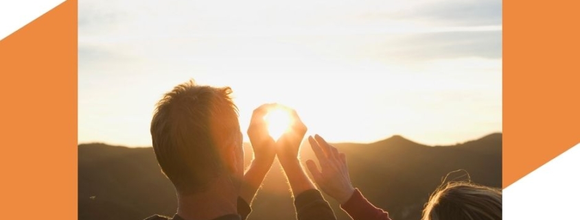 Student with sun in background during a photography art lesson.